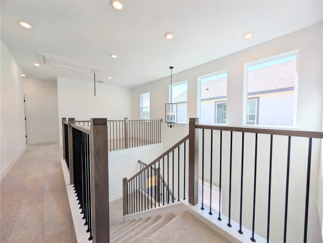 a view of a hallway with windows