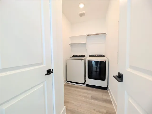 a utility room with washer and dryer