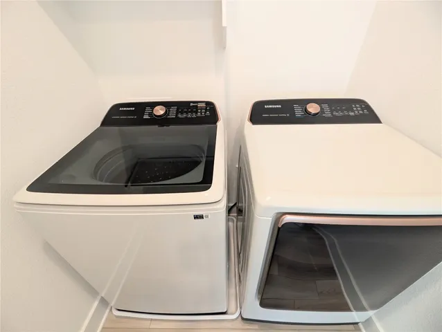 a utility room with dryer and washer