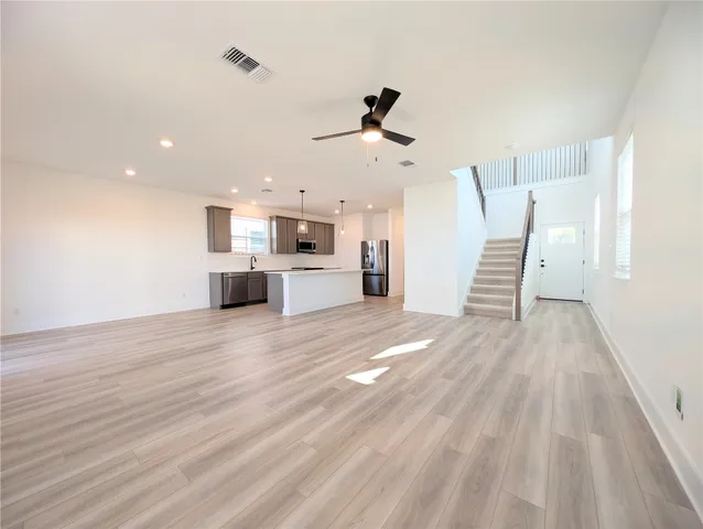 a view of kitchen and wooden floor