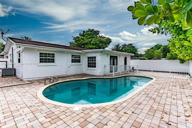 a view of a swimming pool with an outdoor space