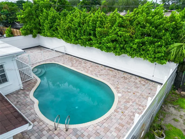 a view of a backyard with a tub