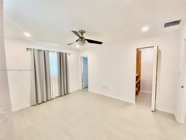 a bathroom with a tub and shower