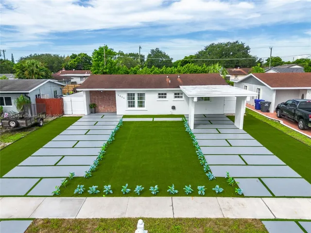 a view of a house with swimming pool