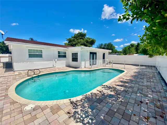 a view of a kitchen with microwave and cabinets
