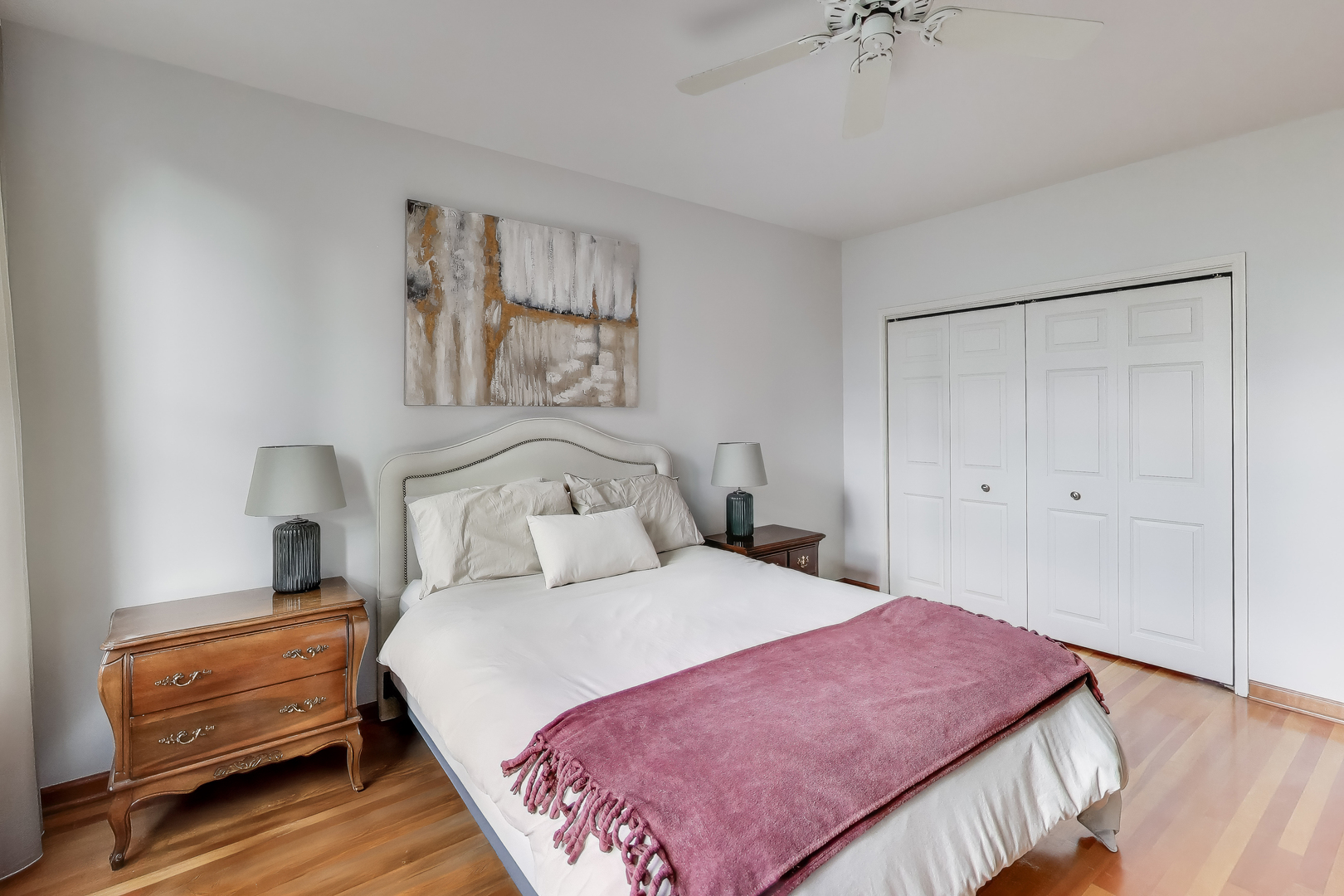 55 West Delaware Place, Unit 810 Chicago, IL 60610 - Photo 14 of 29 a bedroom with a bed and a chandelier