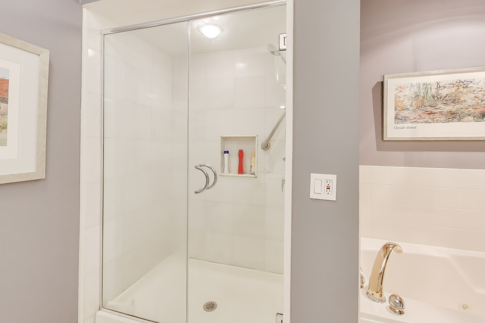 55 West Delaware Place, Unit 810 Chicago, IL 60610 - Photo 16 of 29 a bathroom with a shower and a sink