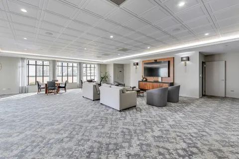 a view of a patio with a table and chairs