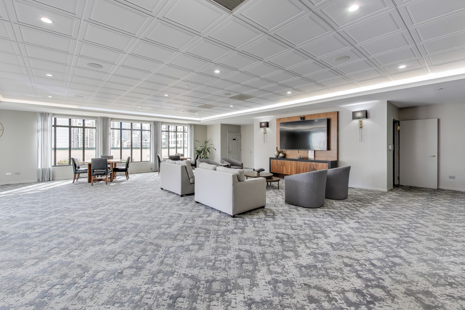 55 West Delaware Place, Unit 810 Chicago, IL 60610 - Photo 25 of 29 a living room with furniture and a flat screen tv