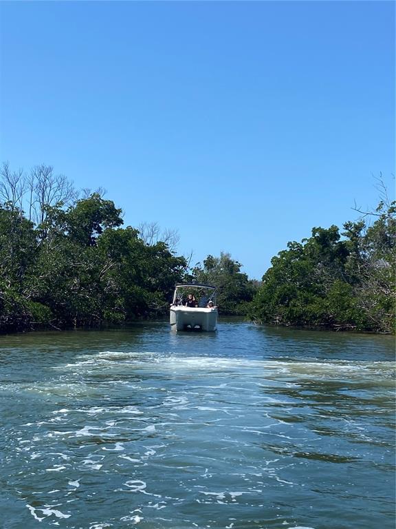 7 Access Undetermined Boca Grande, FL 33921 - Photo 13 of 33 a view of a lake with houses in the background
