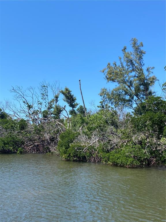 7 Access Undetermined Boca Grande, FL 33921 - Photo 22 of 33 a view of a lake with a house in background