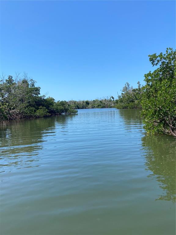 7 Access Undetermined Boca Grande, FL 33921 - Photo 24 of 33 a view of a lake with houses