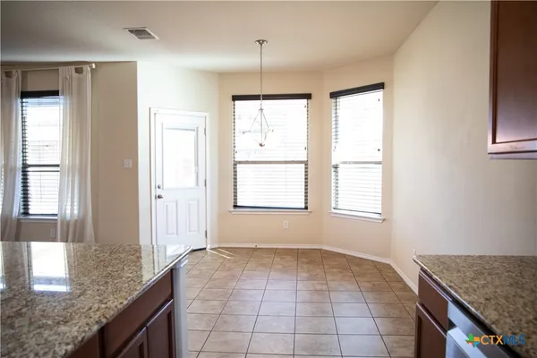 storage and utility room with window