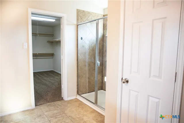 a view of a bathroom from a hallway