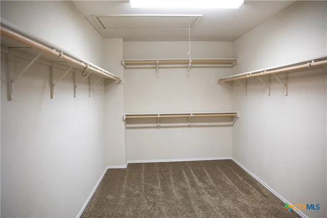 a view of an empty walk in closet