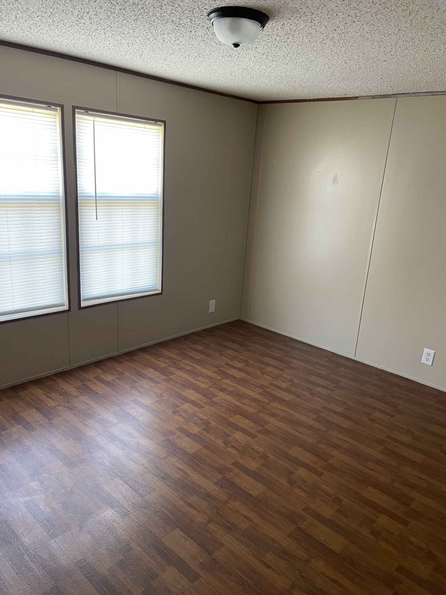 324 Powell Road Red Boiling Springs, TN 37150 - Photo 11 of 13 an empty room with wooden floor and windows