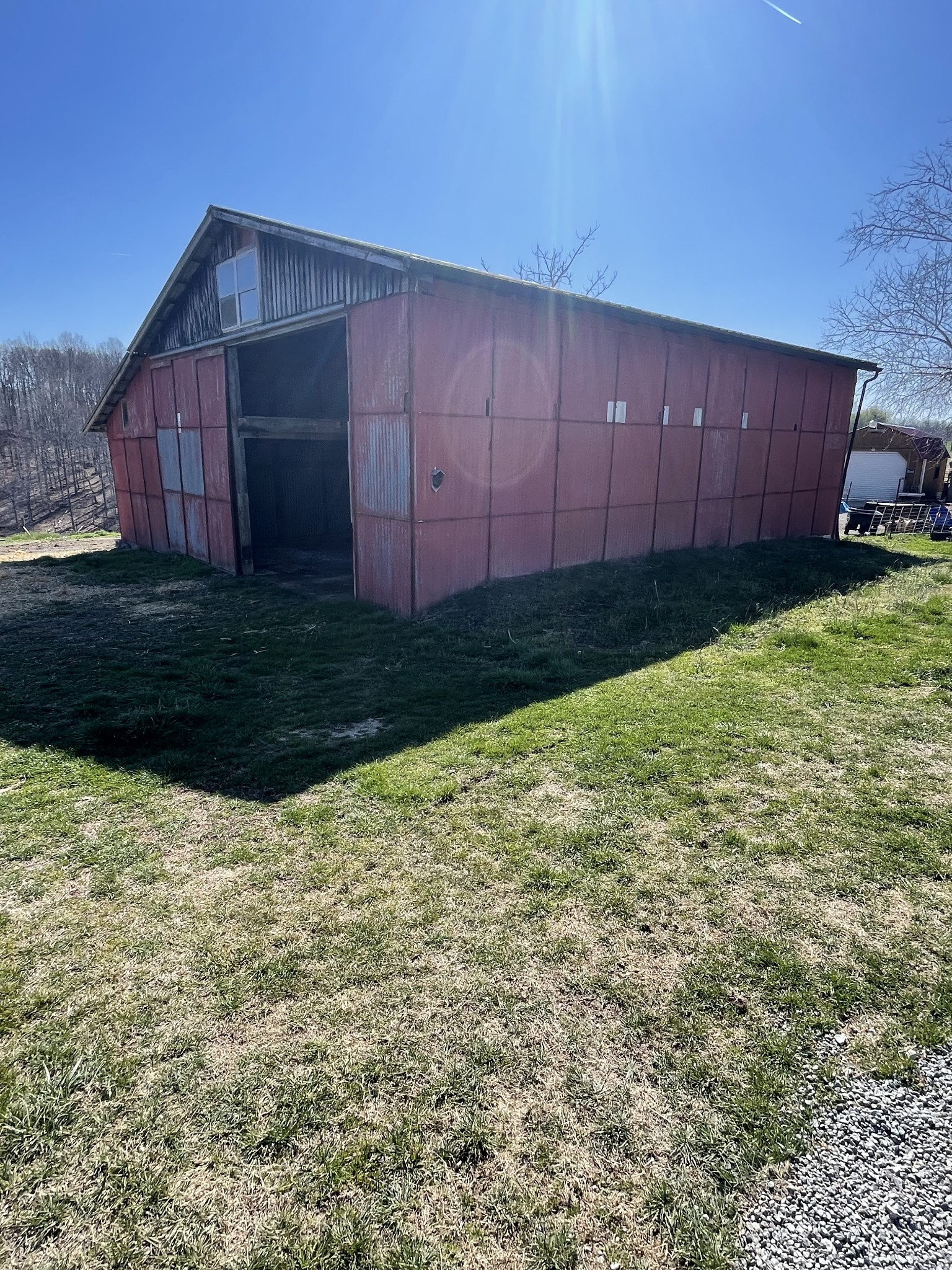 324 Powell Road Red Boiling Springs, TN 37150 - Photo 4 of 13 a view of backyard with potted plants and wooden fence