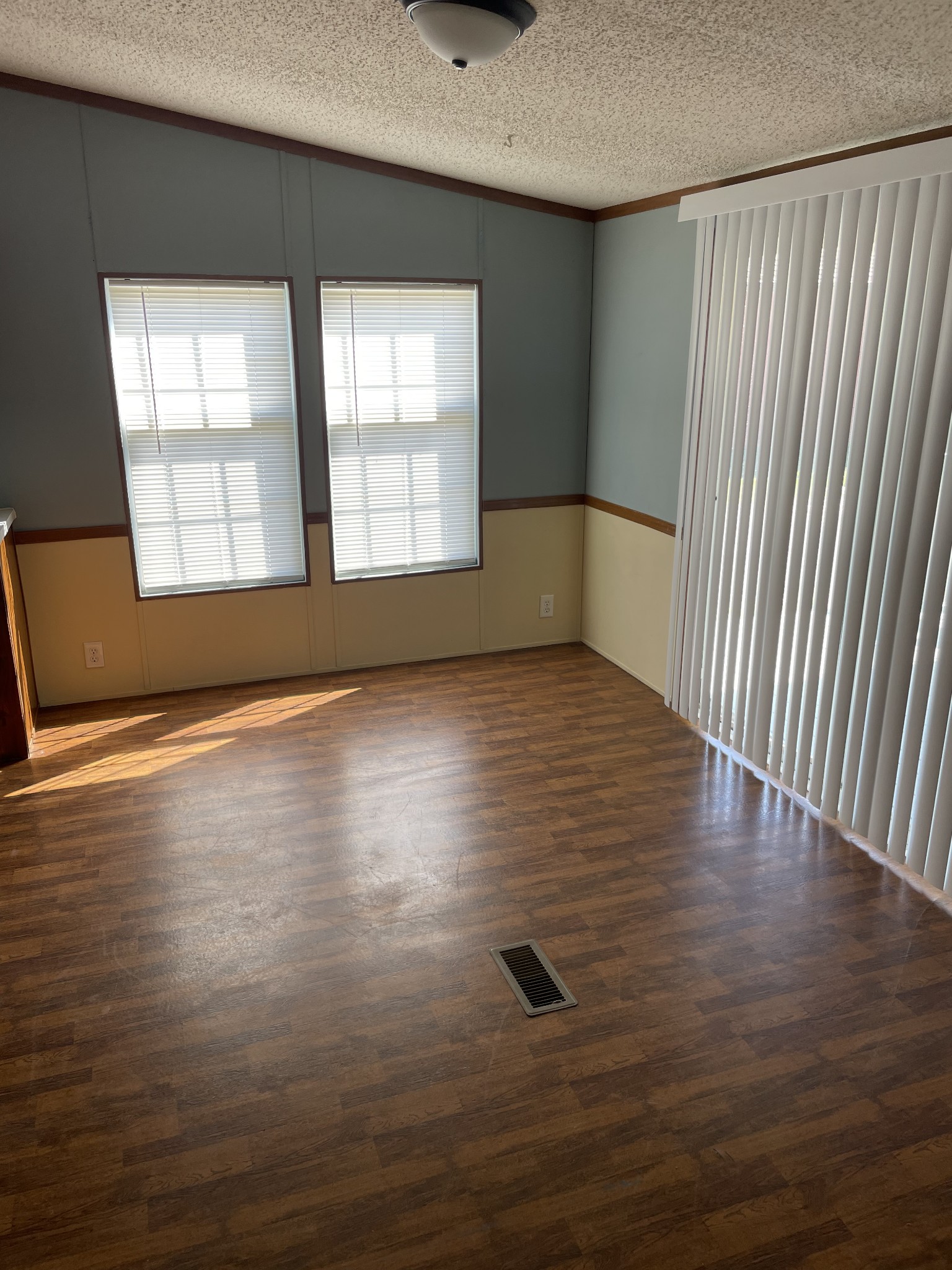 324 Powell Road Red Boiling Springs, TN 37150 - Photo 6 of 13 an empty room with wooden floor and windows