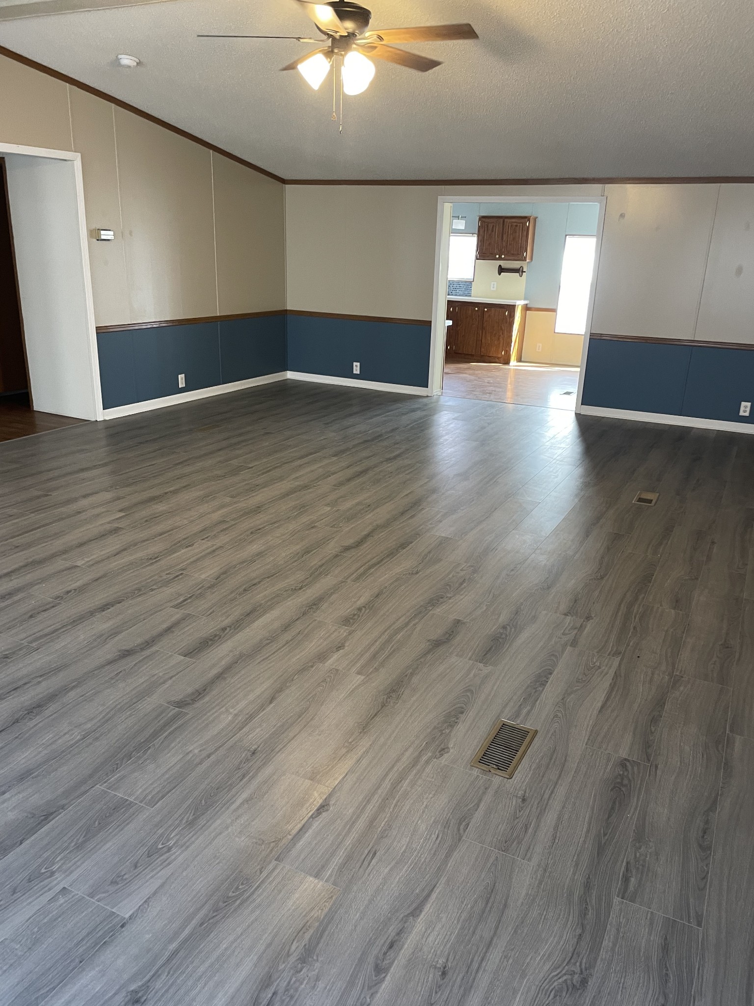 324 Powell Road Red Boiling Springs, TN 37150 - Photo 7 of 13 a view of an empty room with wooden floor