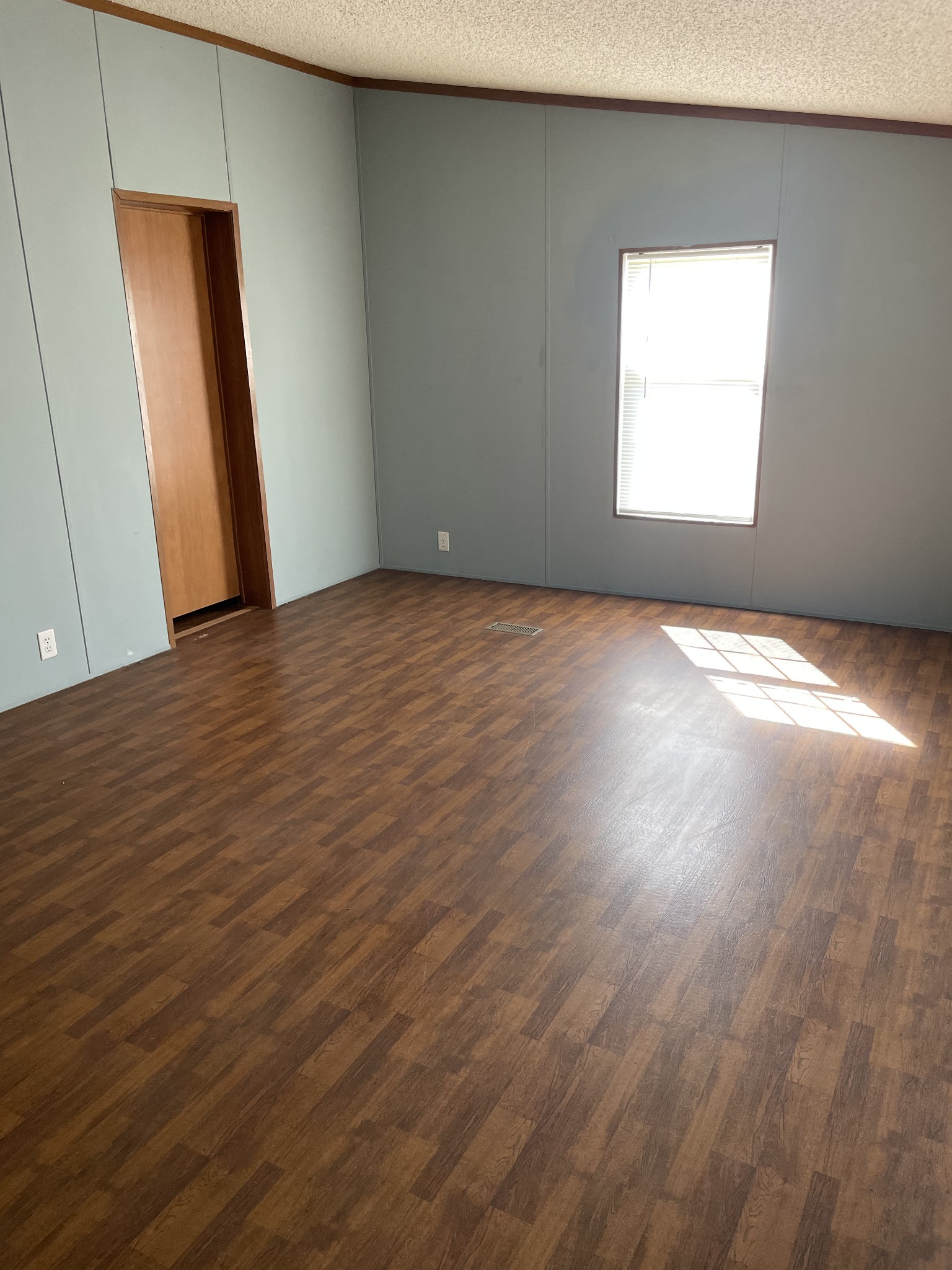 324 Powell Road Red Boiling Springs, TN 37150 - Photo 8 of 13 an empty room with wooden floor and windows
