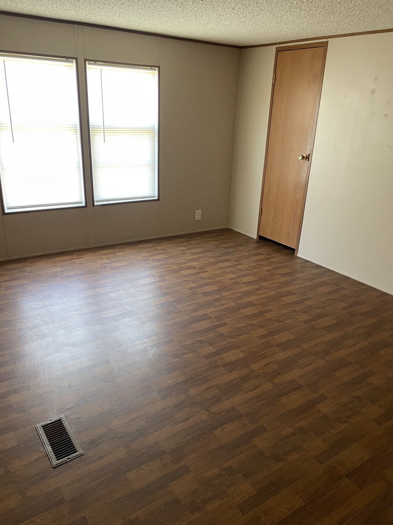 324 Powell Road Red Boiling Springs, TN 37150 - Photo 10 of 13 an empty room with wooden floor and windows