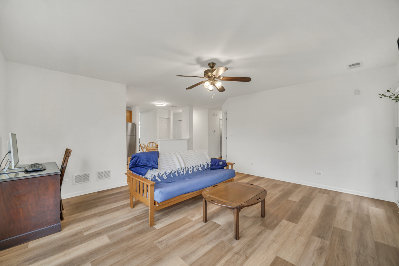 1204 Georgetown Way Vernon Hills, IL 60061 - Photo 13 of 30 a living room with furniture and a wooden floor