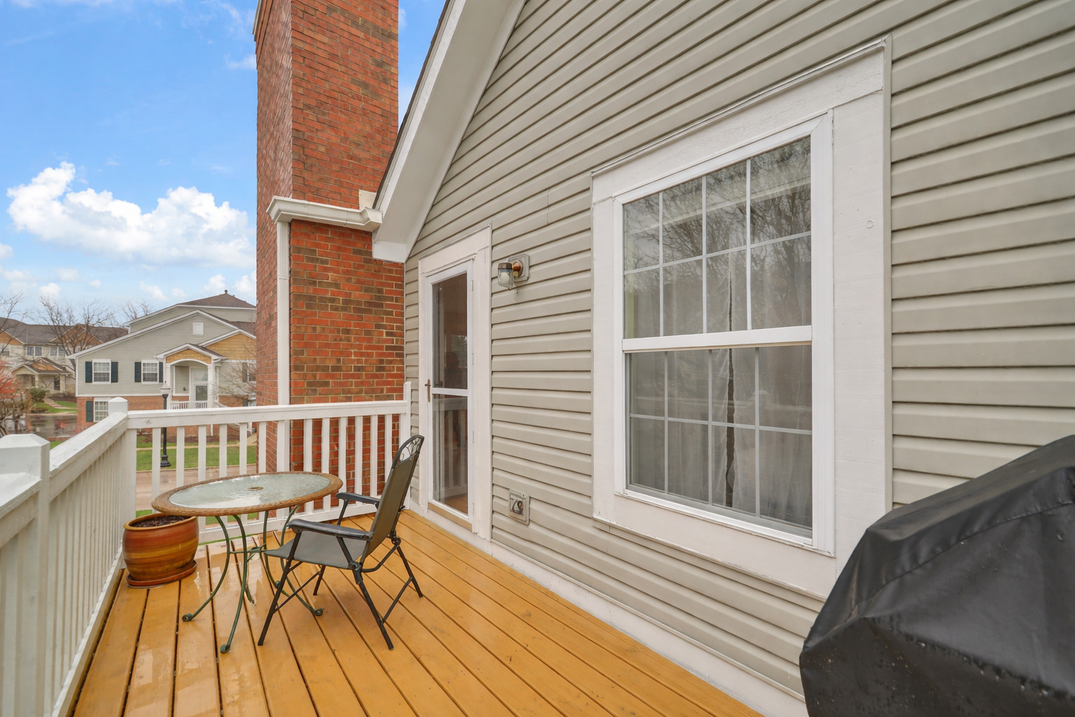 1204 Georgetown Way Vernon Hills, IL 60061 - Photo 16 of 30 a view of a chair and table on the deck