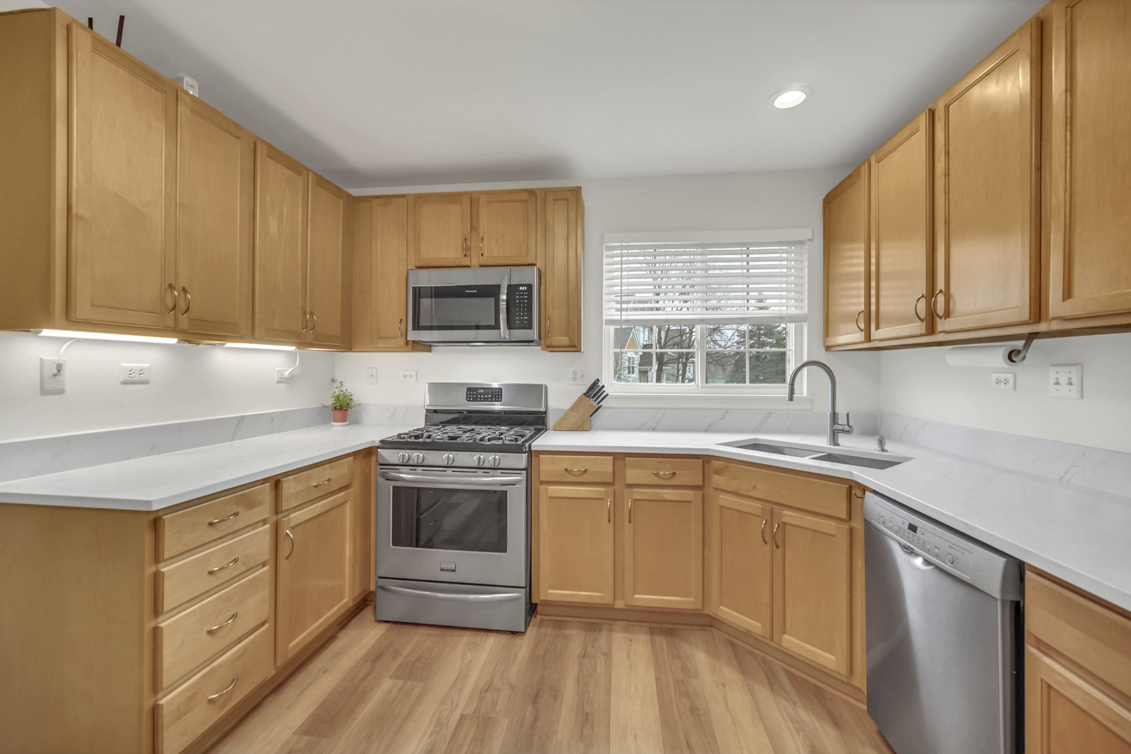 1204 Georgetown Way Vernon Hills, IL 60061 - Photo 18 of 30 a kitchen with a sink stove top oven and cabinets