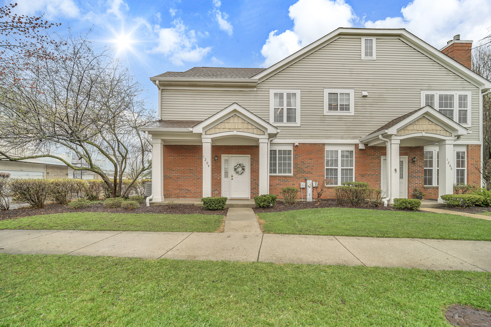 1204 Georgetown Way Vernon Hills, IL 60061 - Photo 2 of 30 a front view of a house with a yard
