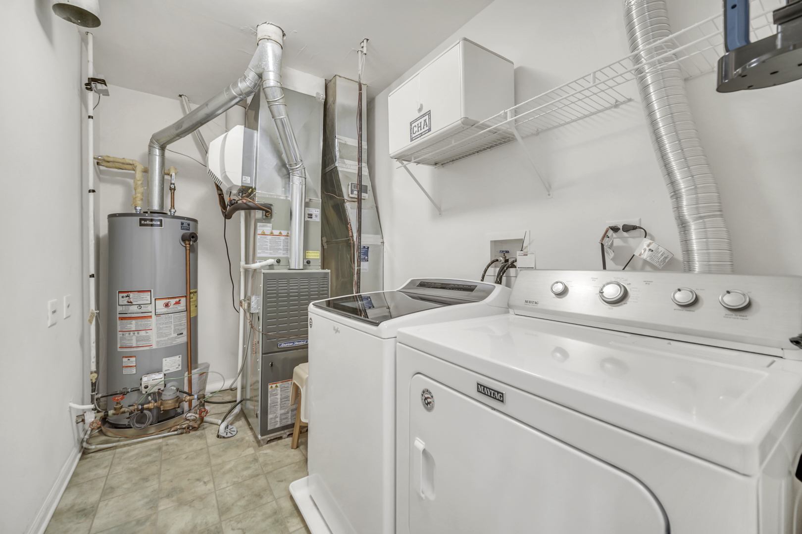 1204 Georgetown Way Vernon Hills, IL 60061 - Photo 21 of 30 a utility room with dryer and washer