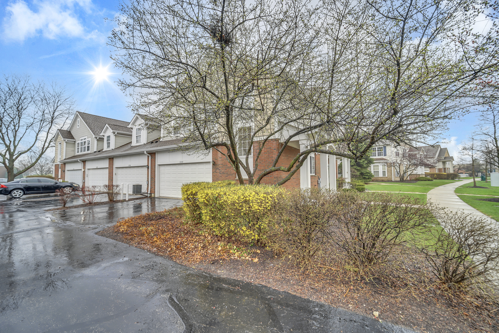 1204 Georgetown Way Vernon Hills, IL 60061 - Photo 3 of 30 a view of a house with garden and trees
