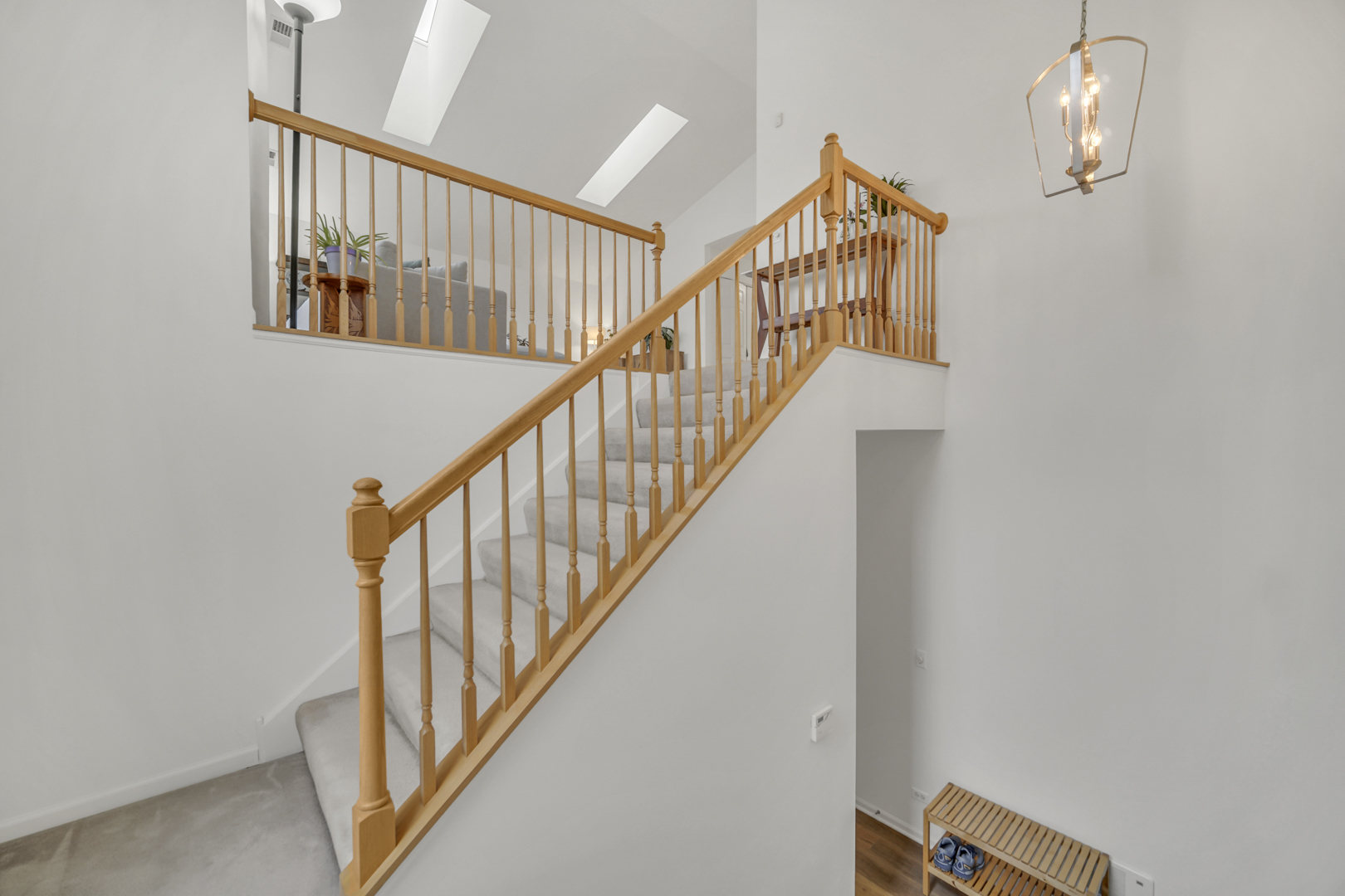 1204 Georgetown Way Vernon Hills, IL 60061 - Photo 6 of 30 a view of staircase with lots of windows and wooden floor