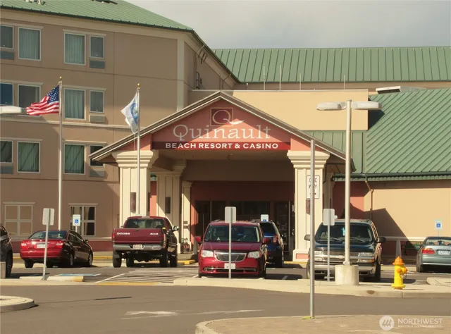 a view of street with parked cars