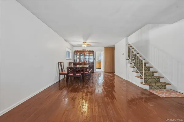 a view of dining room and hall with wooden floor
