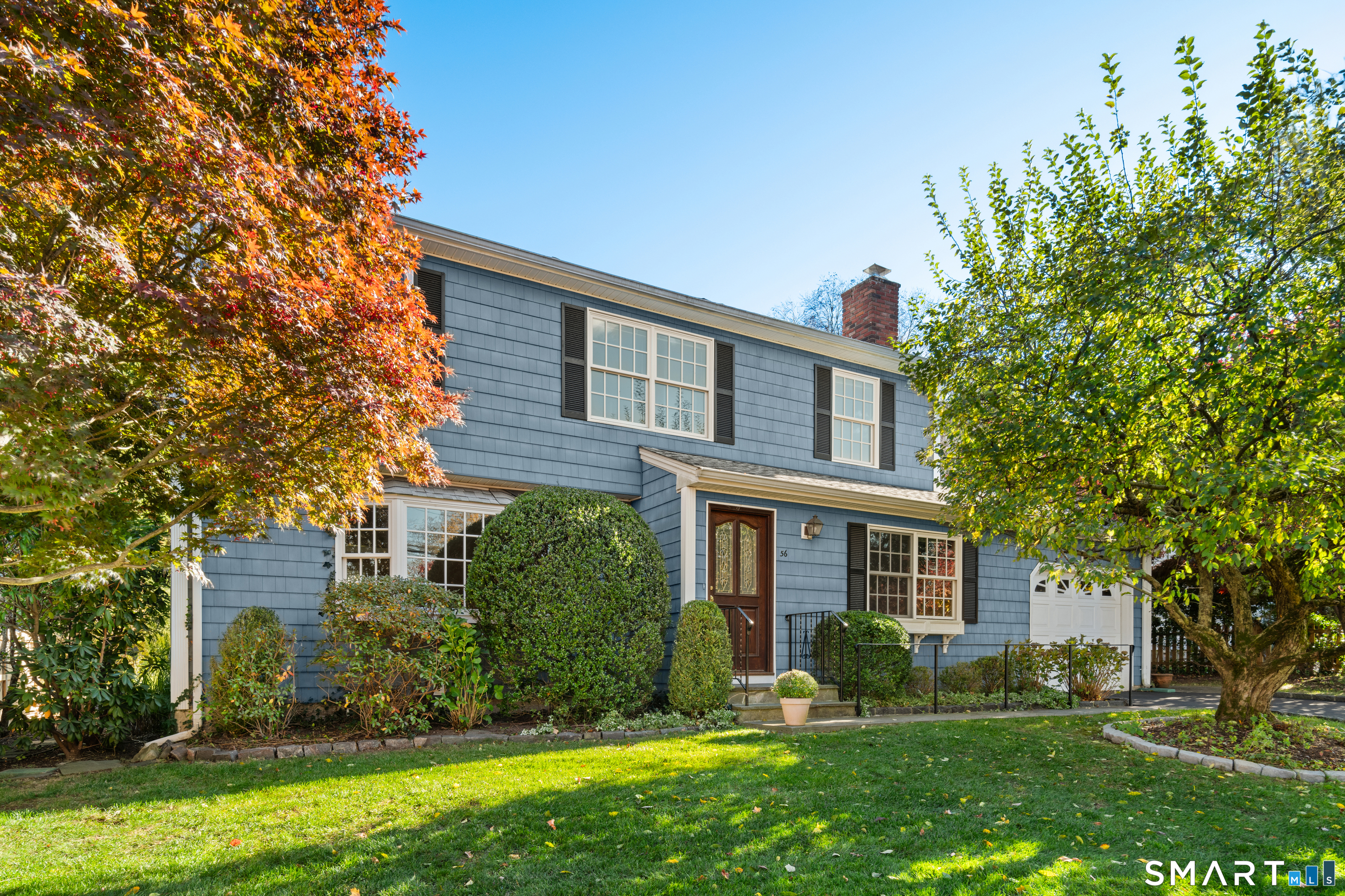 front view of a house with a yard