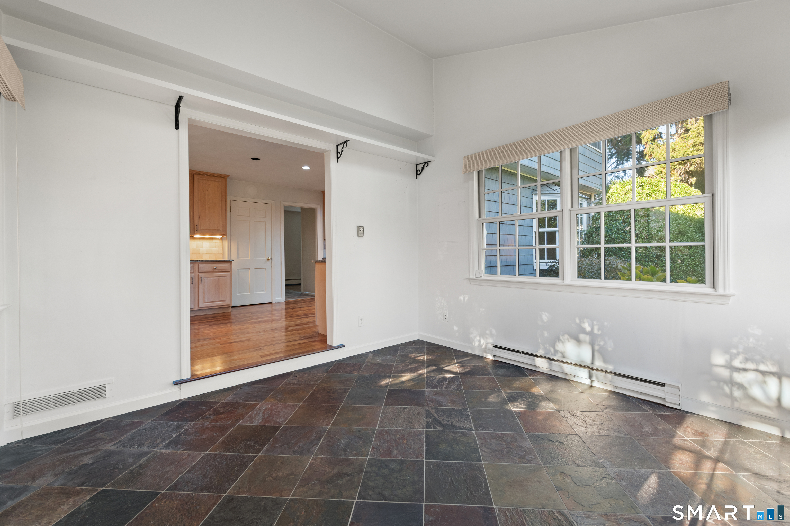 56 Drake Lane Fairfield, CT 06824 - Photo 14 of 35 an empty room with windows and entrance