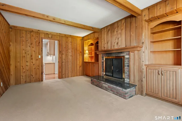 a view of a fireplace with an empty room