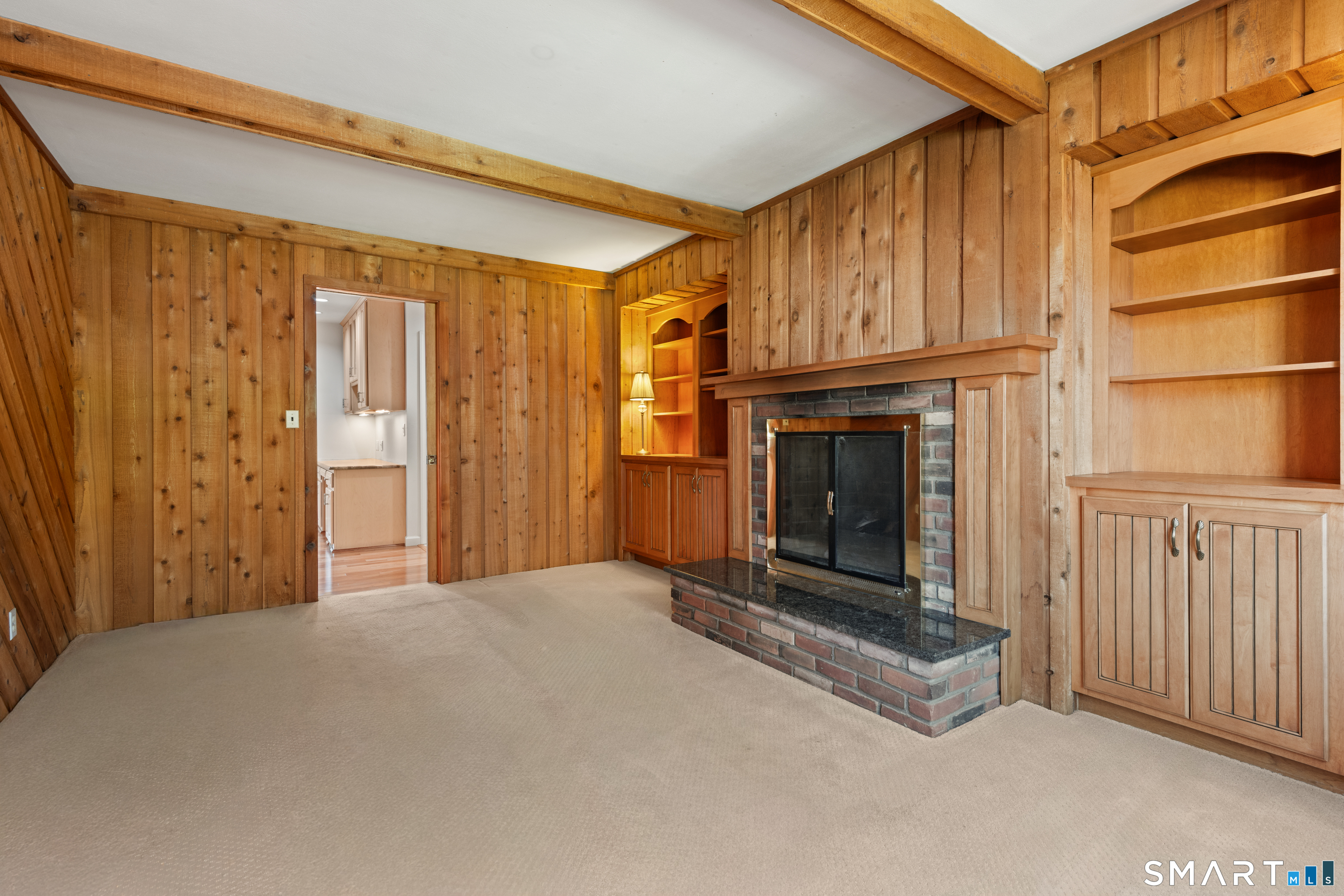 56 Drake Lane Fairfield, CT 06824 - Photo 18 of 35 a view of a fireplace with an empty room