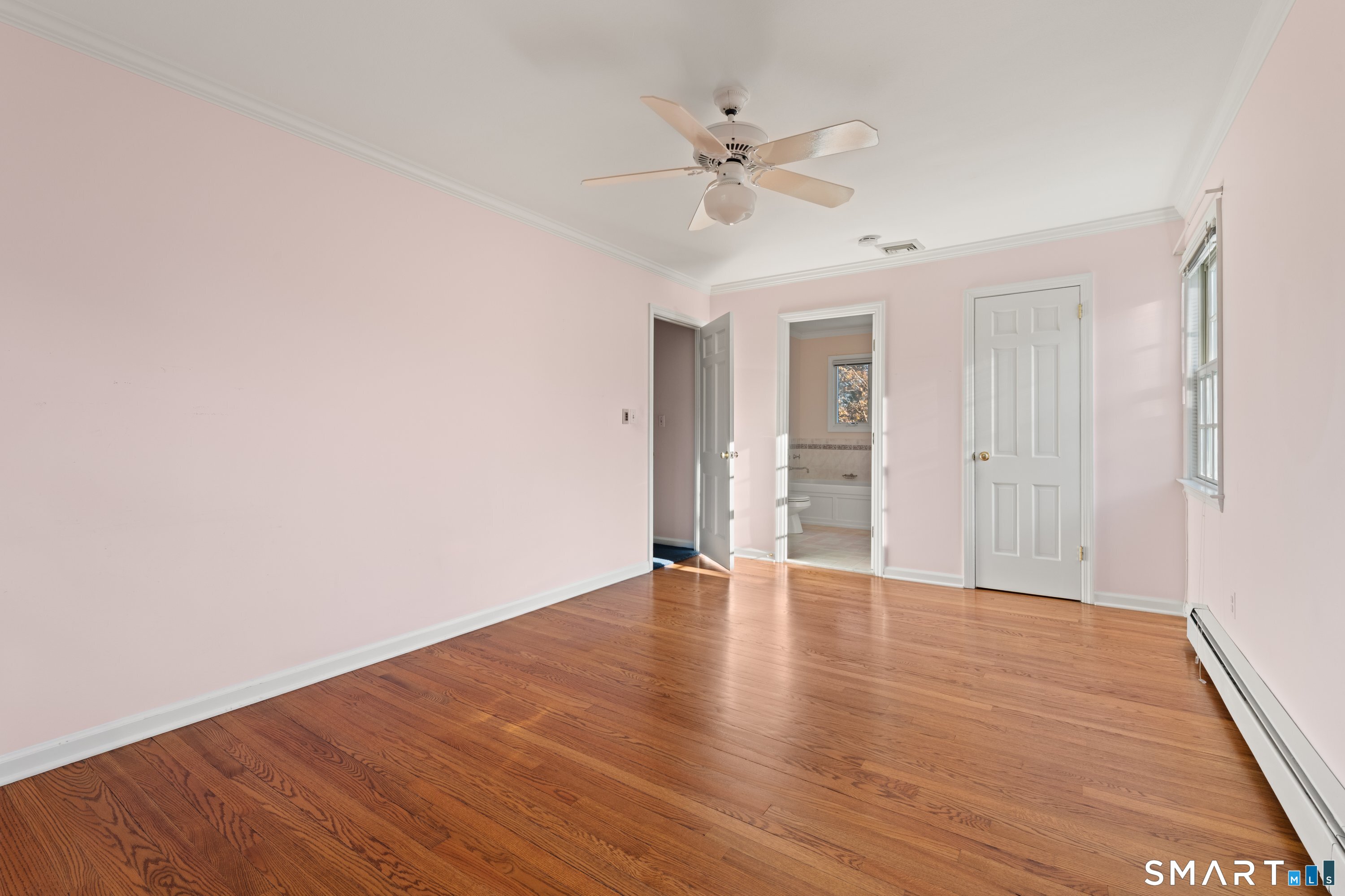 56 Drake Lane Fairfield, CT 06824 - Photo 21 of 35 a view of an empty room with wooden floor