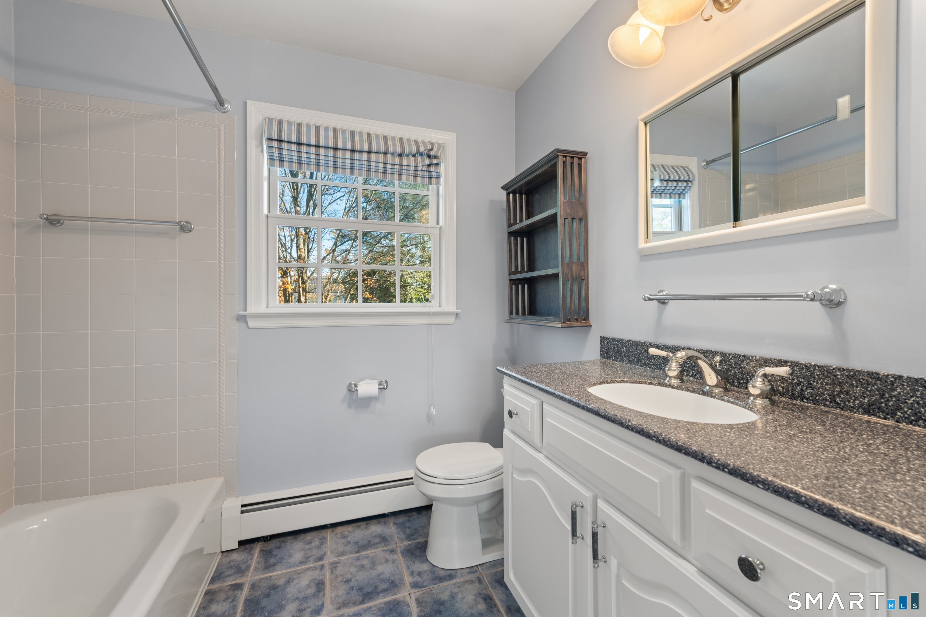 56 Drake Lane Fairfield, CT 06824 - Photo 26 of 35 a bathroom with a granite countertop toilet a sink and a bathtub