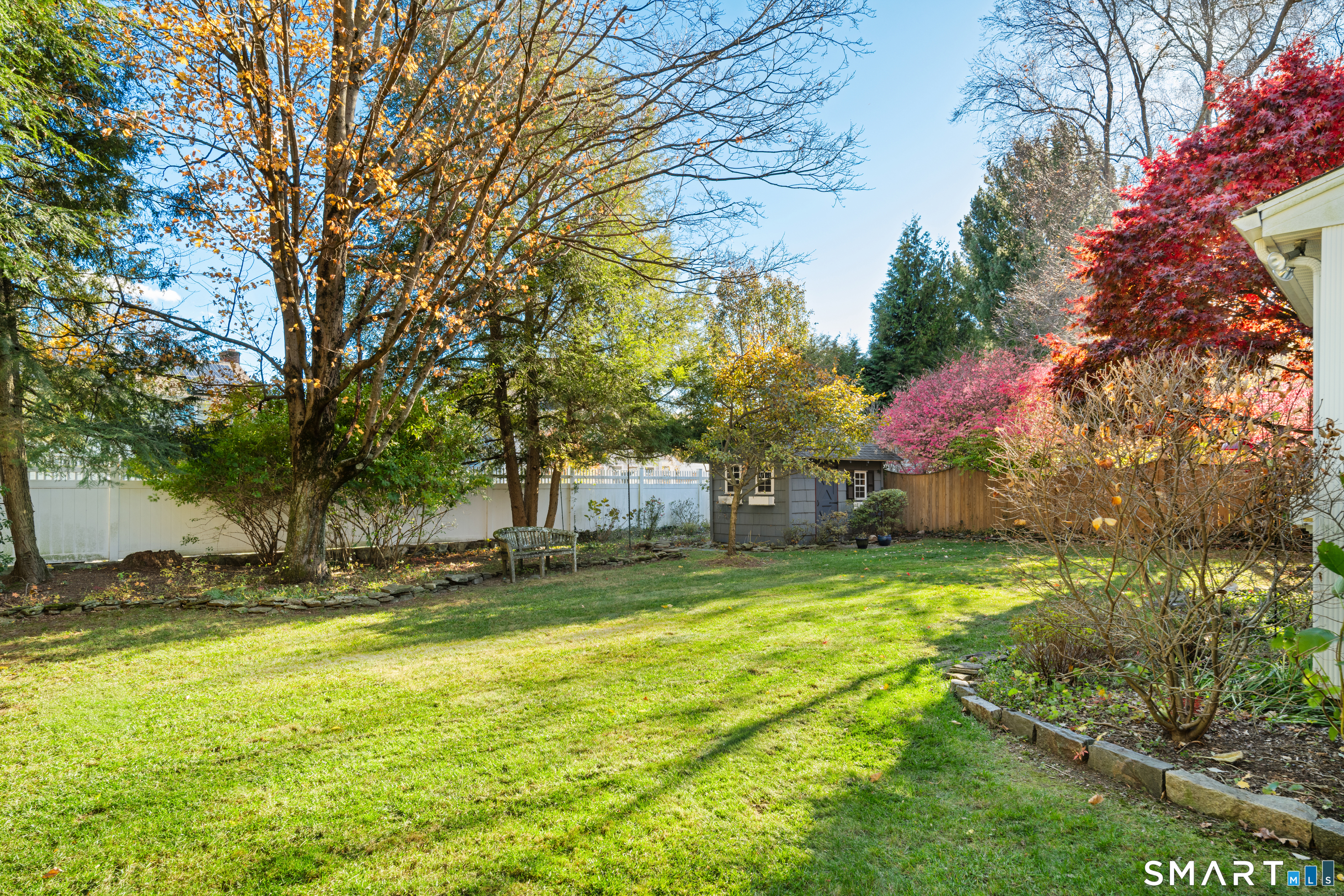 56 Drake Lane Fairfield, CT 06824 - Photo 31 of 35 a view of a yard with a tree