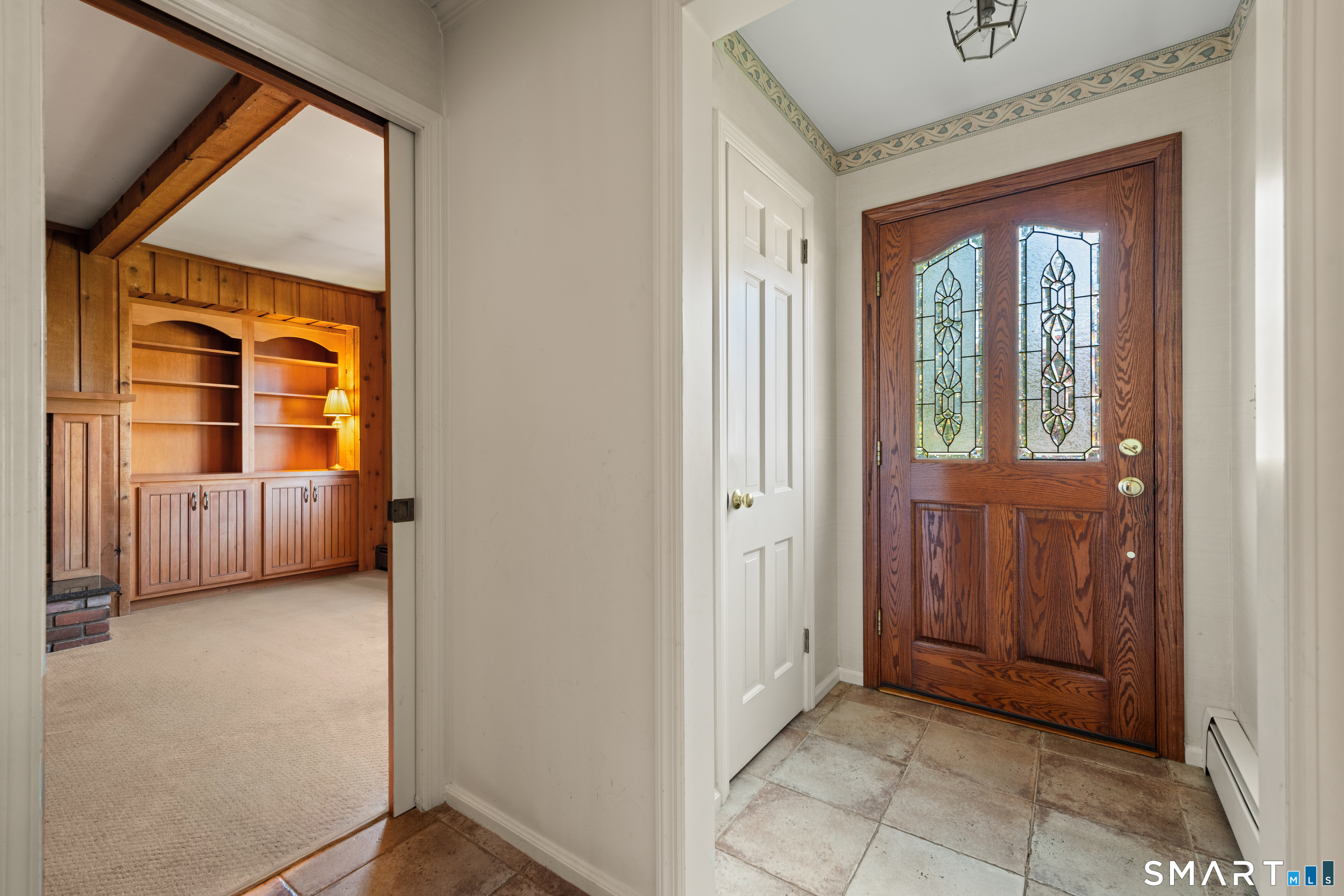 56 Drake Lane Fairfield, CT 06824 - Photo 4 of 35 a view of an entryway with a livingroom