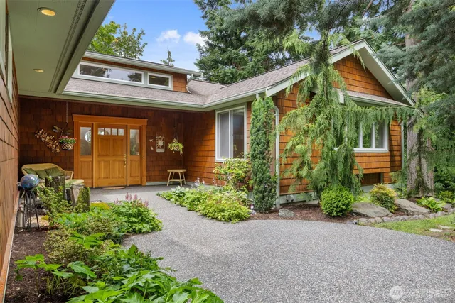 a front view of a house with garden