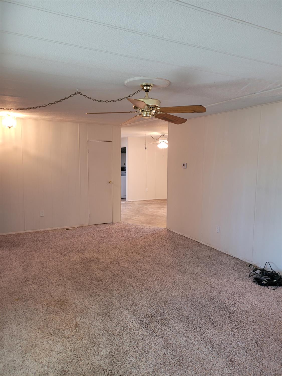3955 Coffee Road, Unit 53 Modesto, CA 95355 - Photo 15 of 26 a view of a big room with a chandelier fan