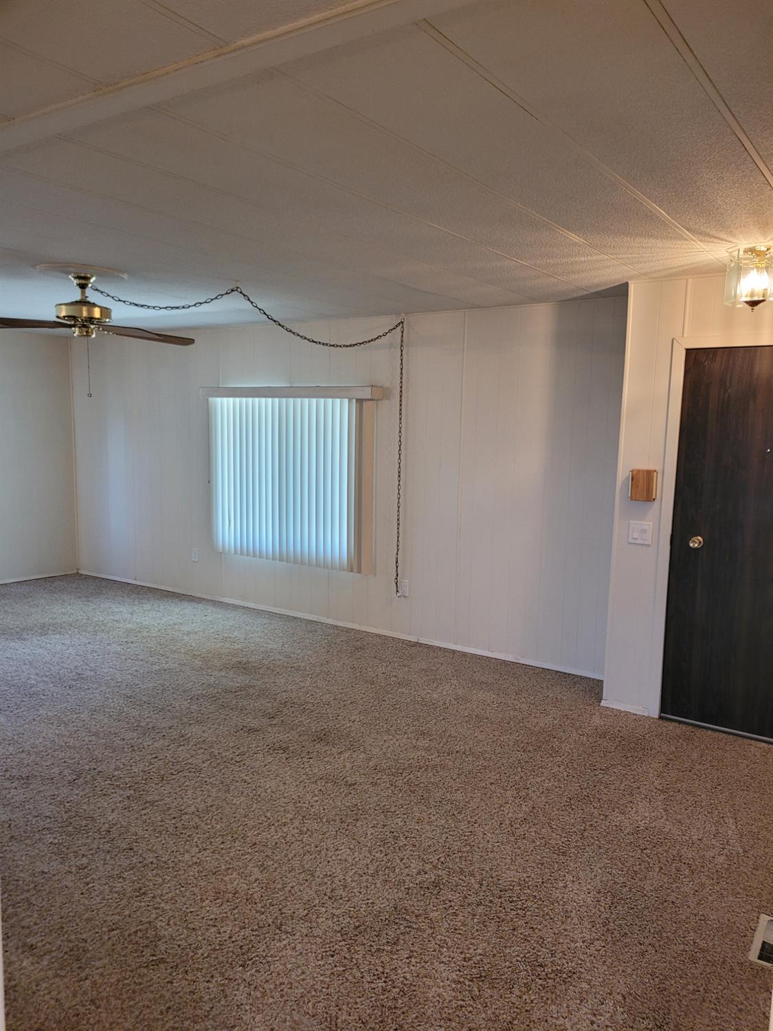 3955 Coffee Road, Unit 53 Modesto, CA 95355 - Photo 16 of 26 a view of an empty room with a window