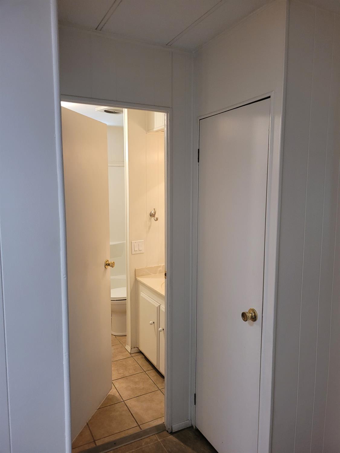 3955 Coffee Road, Unit 53 Modesto, CA 95355 - Photo 23 of 26 a view of a bathroom with a glass door