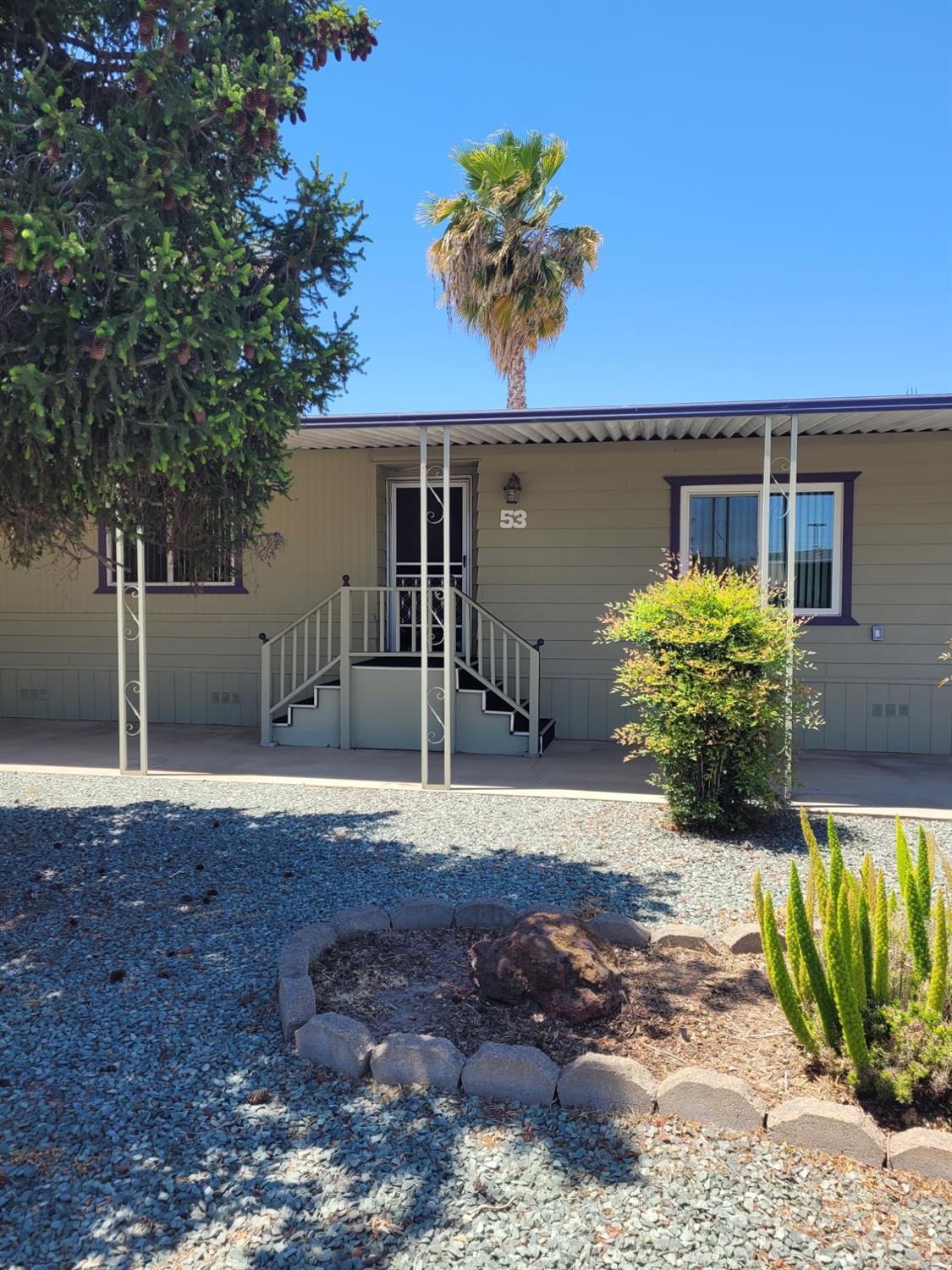 3955 Coffee Road, Unit 53 Modesto, CA 95355 - Photo 3 of 26 a front view of a house with garden