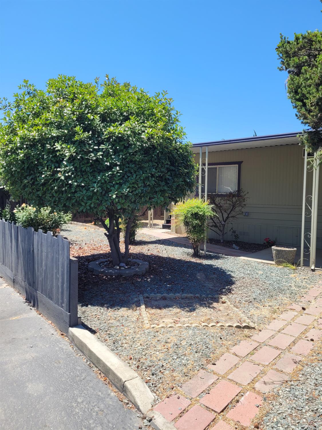 3955 Coffee Road, Unit 53 Modesto, CA 95355 - Photo 4 of 26 a view of a backyard of the house