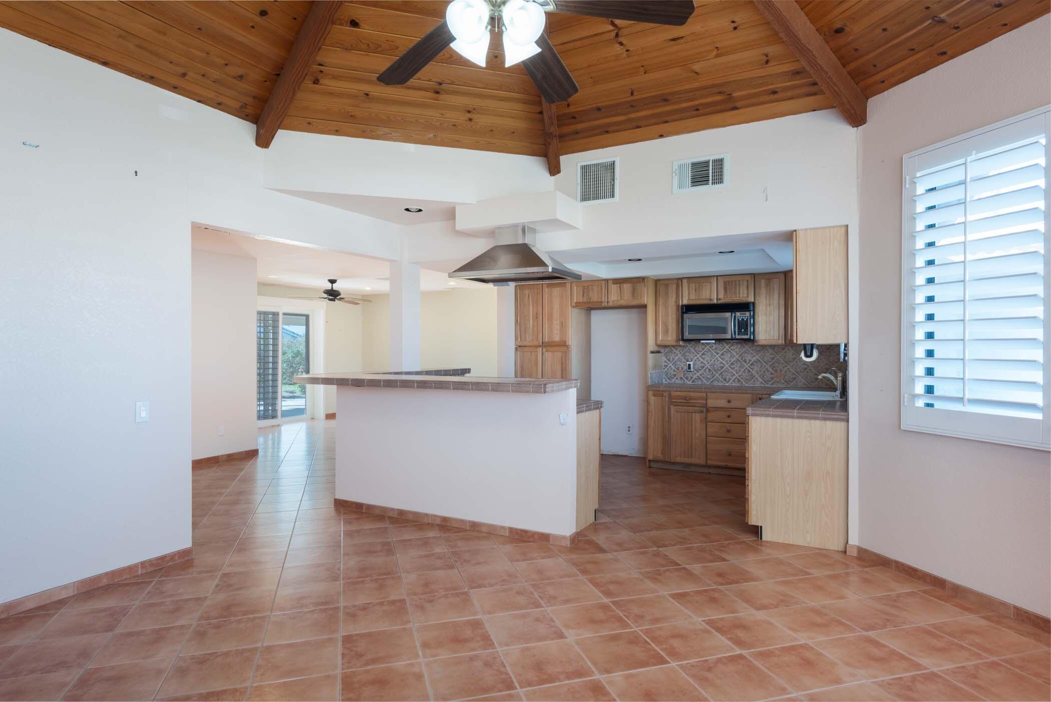 67705 Ovante Road Cathedral City, CA 92234 - Photo 12 of 34 a view of a kitchen with a sink and dishwasher cabinets
