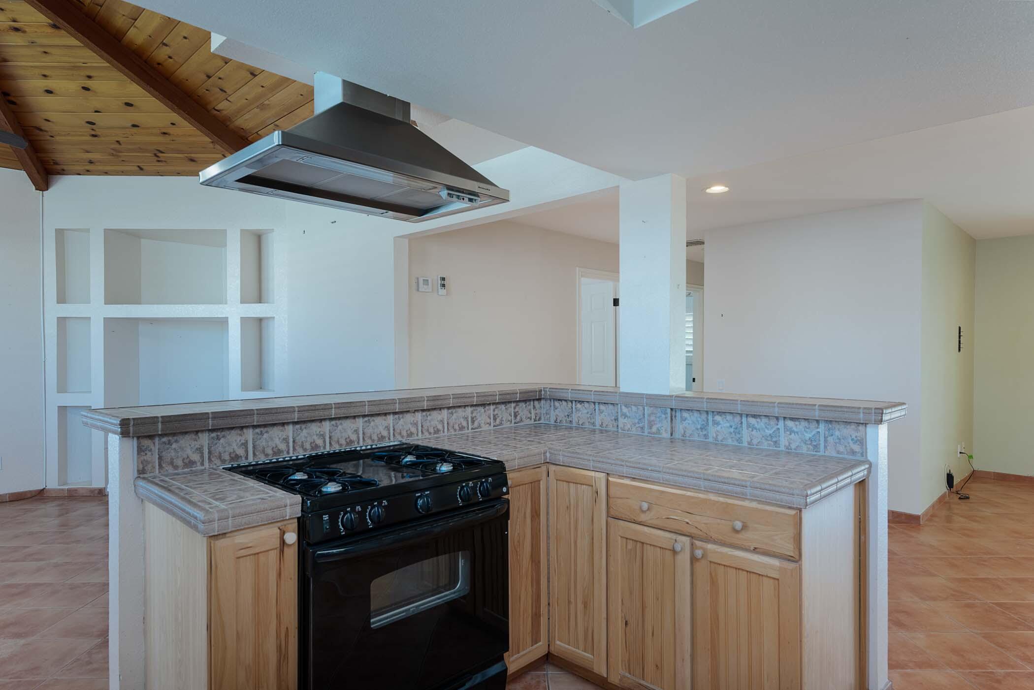 67705 Ovante Road Cathedral City, CA 92234 - Photo 15 of 34 a view of kitchen with granite countertop stove top oven